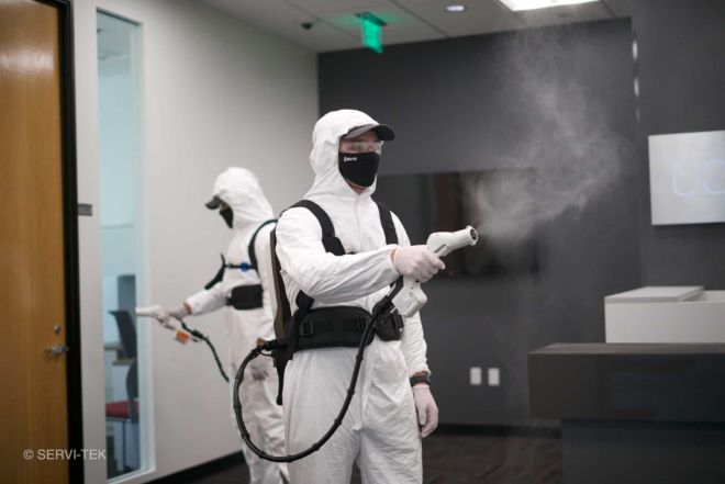 Janitors disinfecting offices